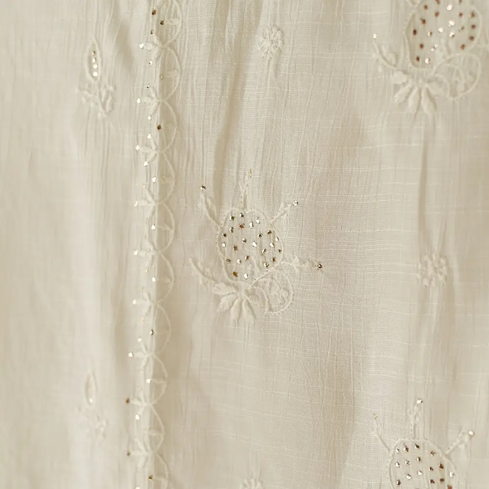 semi stitched viscose slub kurti with elegant embroidery panel design and dupatta with mukaish highlights in ethereal ivory color