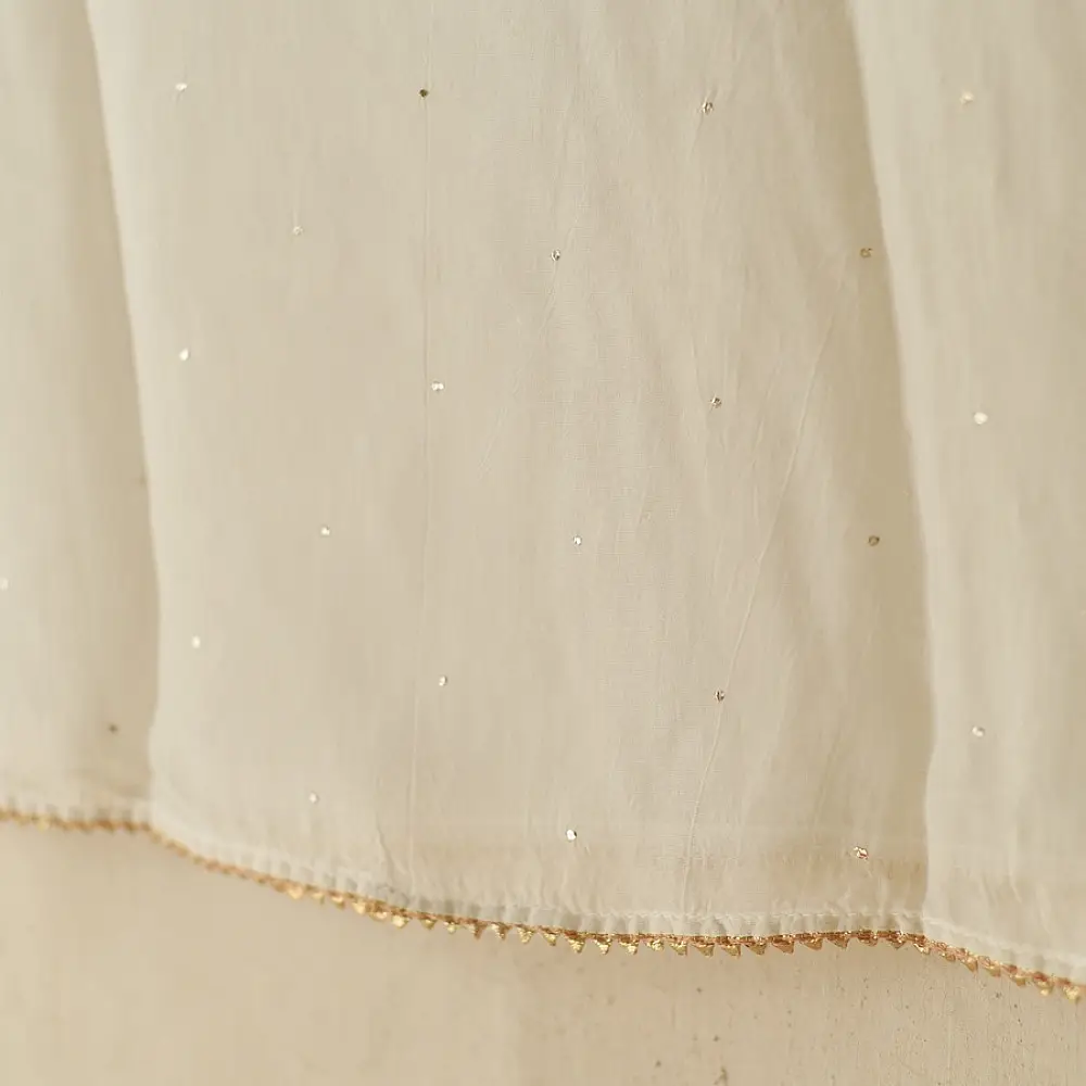 semi stitched viscose slub kurti with elegant embroidery panel design and dupatta with mukaish highlights in ethereal ivory color