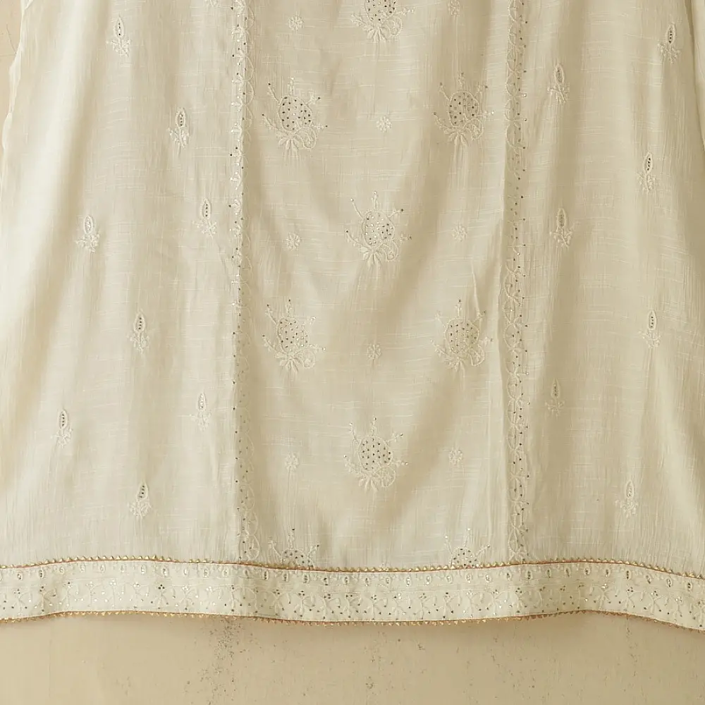 semi stitched viscose slub kurti with elegant embroidery panel design and dupatta with mukaish highlights in ethereal ivory color