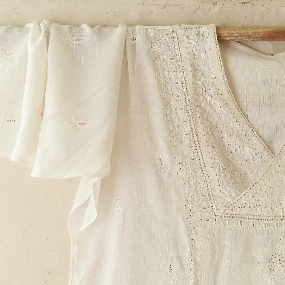 semi stitched viscose slub kurti with elegant embroidery panel design and dupatta with mukaish highlights in ethereal ivory color