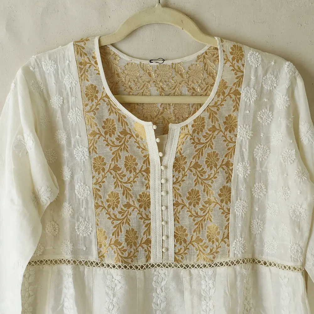 semi stitched pure silk chanderi kurti in off white with intricate hand embroidered resham chikankari and metallic gold brocade yoke and sleeve cuff details