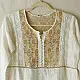 semi stitched pure silk chanderi kurti in off white with intricate hand embroidered resham chikankari and metallic gold brocade yoke and sleeve cuff details
