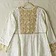 semi stitched pure silk chanderi kurti in off white with intricate hand embroidered resham chikankari and metallic gold brocade yoke and sleeve cuff details