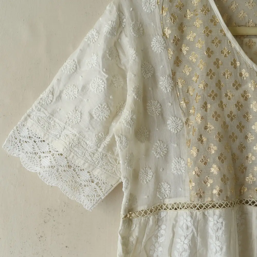 semi stitched pure silk chanderi kurti in off white with intricate hand embroidered resham chikankari and metallic brocade bodice details
