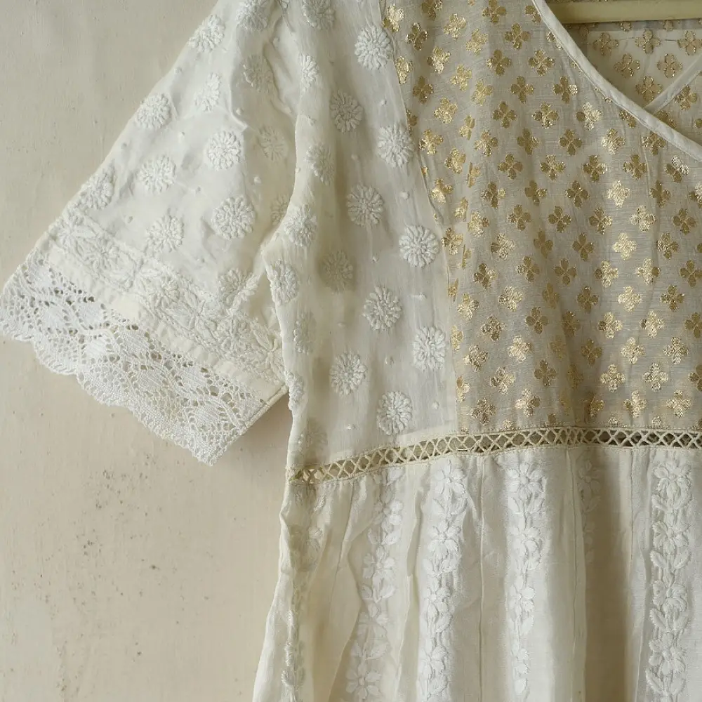 semi stitched pure silk chanderi kurti in off white with intricate hand embroidered resham chikankari and metallic brocade bodice details