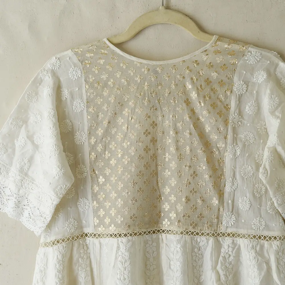 semi stitched pure silk chanderi kurti in off white with intricate hand embroidered resham chikankari and metallic brocade bodice details