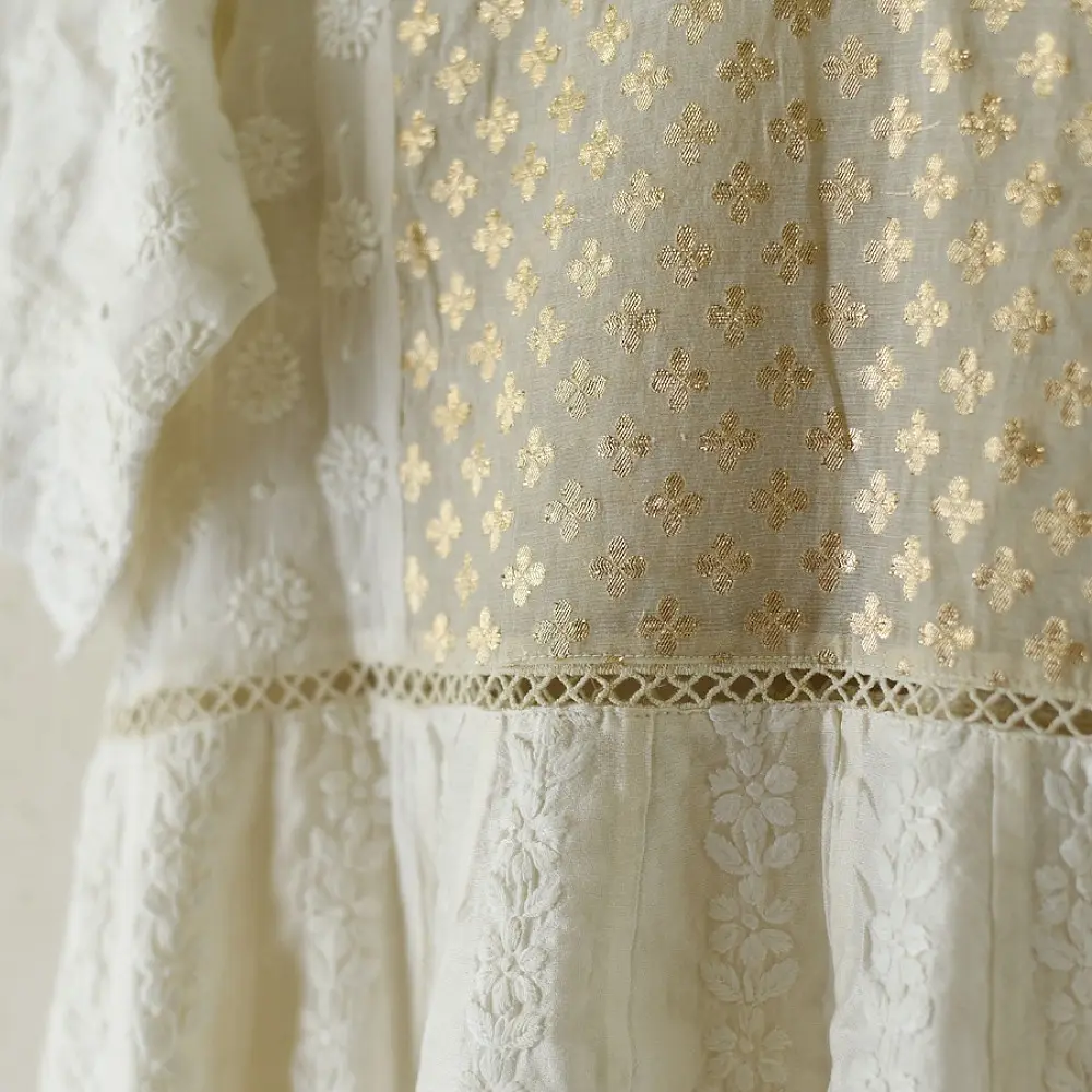 semi stitched pure silk chanderi kurti in off white with intricate hand embroidered resham chikankari and metallic brocade bodice details