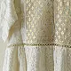semi stitched pure silk chanderi kurti in off white with intricate hand embroidered resham chikankari and metallic brocade bodice details