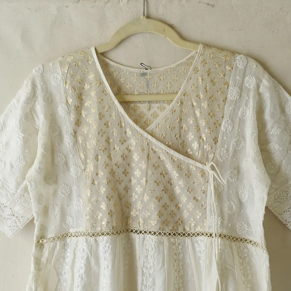 semi stitched pure silk chanderi kurti in off white with intricate hand embroidered resham chikankari and metallic brocade bodice details