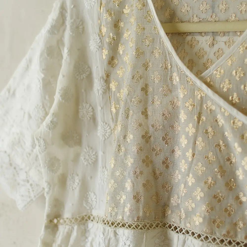 semi stitched pure silk chanderi kurti in off white with intricate hand embroidered resham chikankari and metallic brocade bodice details