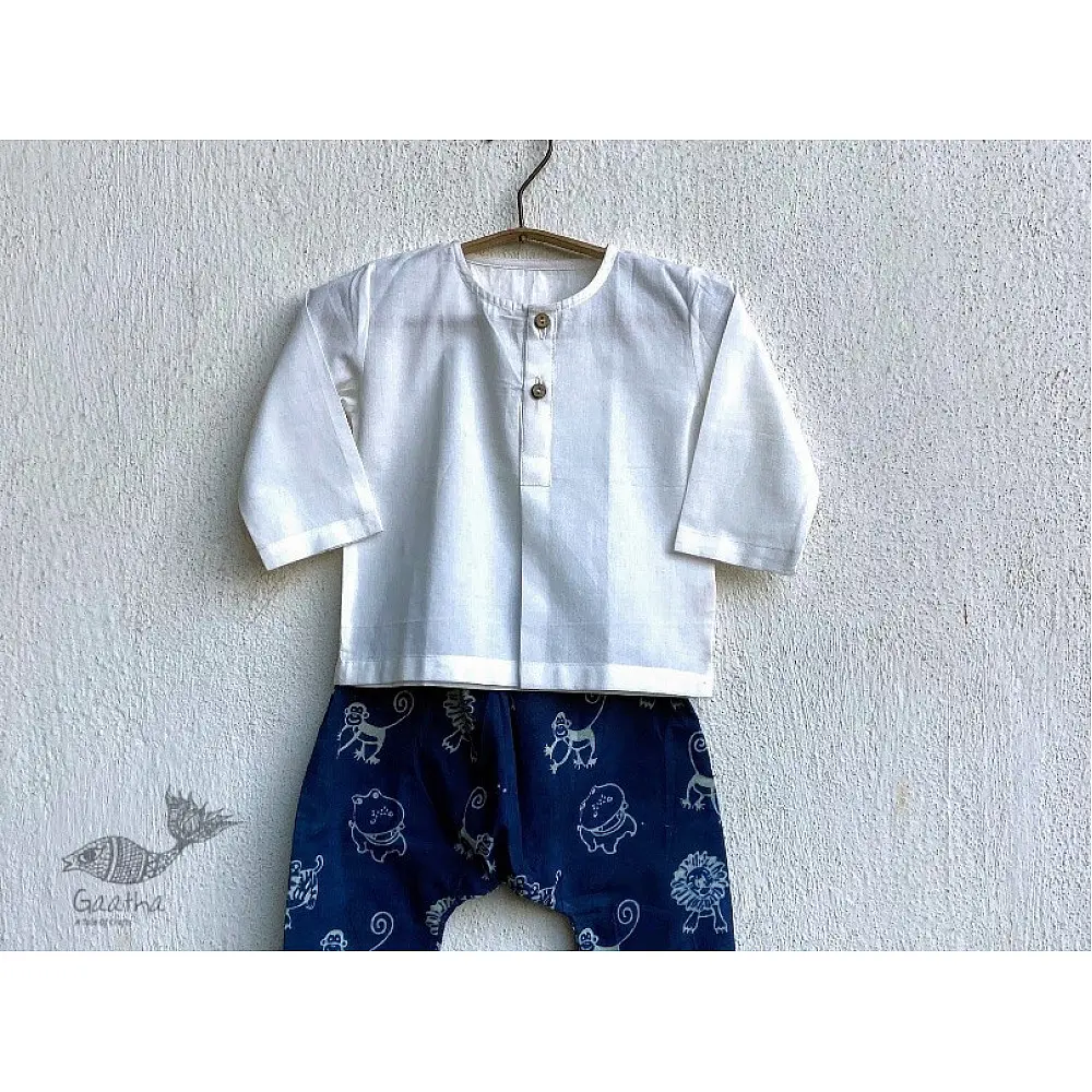 white organic cotton kids shirt paired with indigo blue elephant printed pants