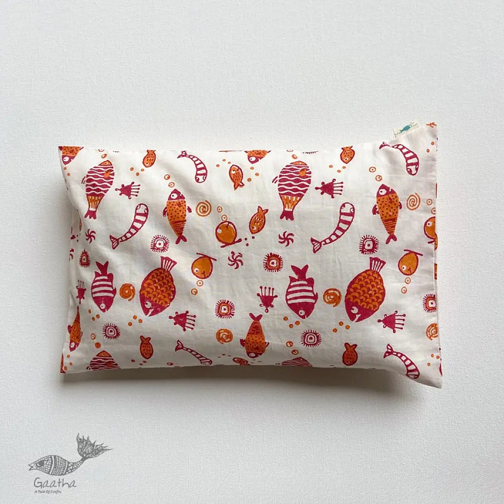 organic cotton kids bedding gift set featuring a cream fish print dohar blanket and a matching koi fish kapok pillow