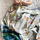 organic cotton kids bedding gift set featuring a cream block printed dhruvtara star dohar blanket sun shaped mustard seed pillow and wooden maracas