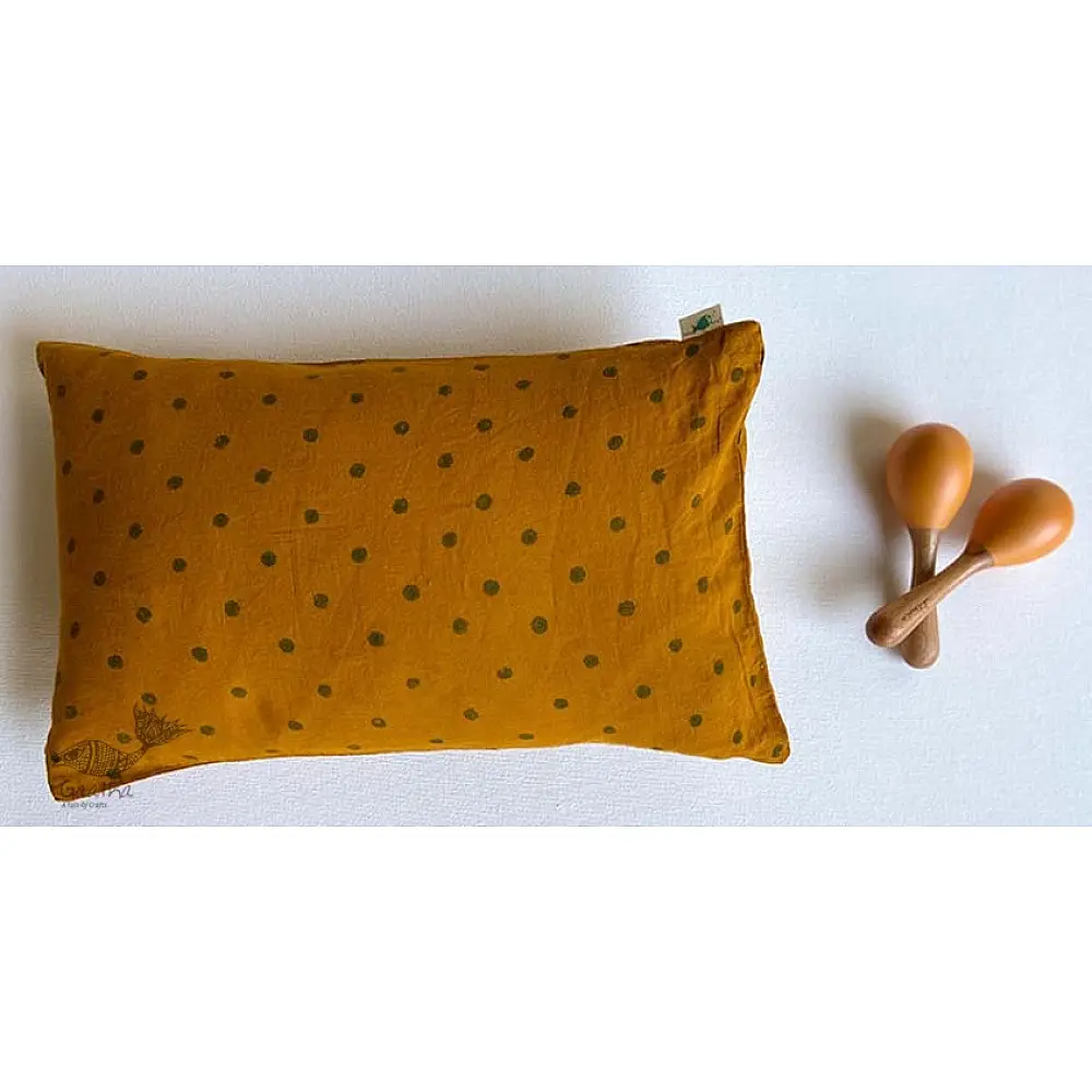 organic cotton kids gift set featuring a mustard yellow raidana micro print kapok pillow and wooden maracas shakers