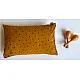 organic cotton kids gift set featuring a mustard yellow raidana micro print kapok pillow and wooden maracas shakers