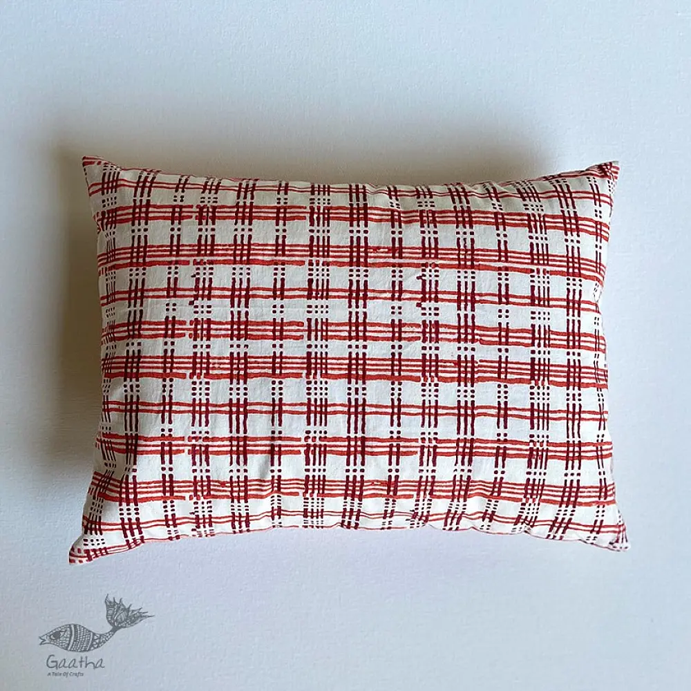 organic cotton kids gift set featuring a red and white checked kapok pillow and wooden maracas shakers