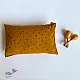 organic cotton kids gift set featuring a mustard yellow raidana micro print kapok pillow and wooden maracas shakers