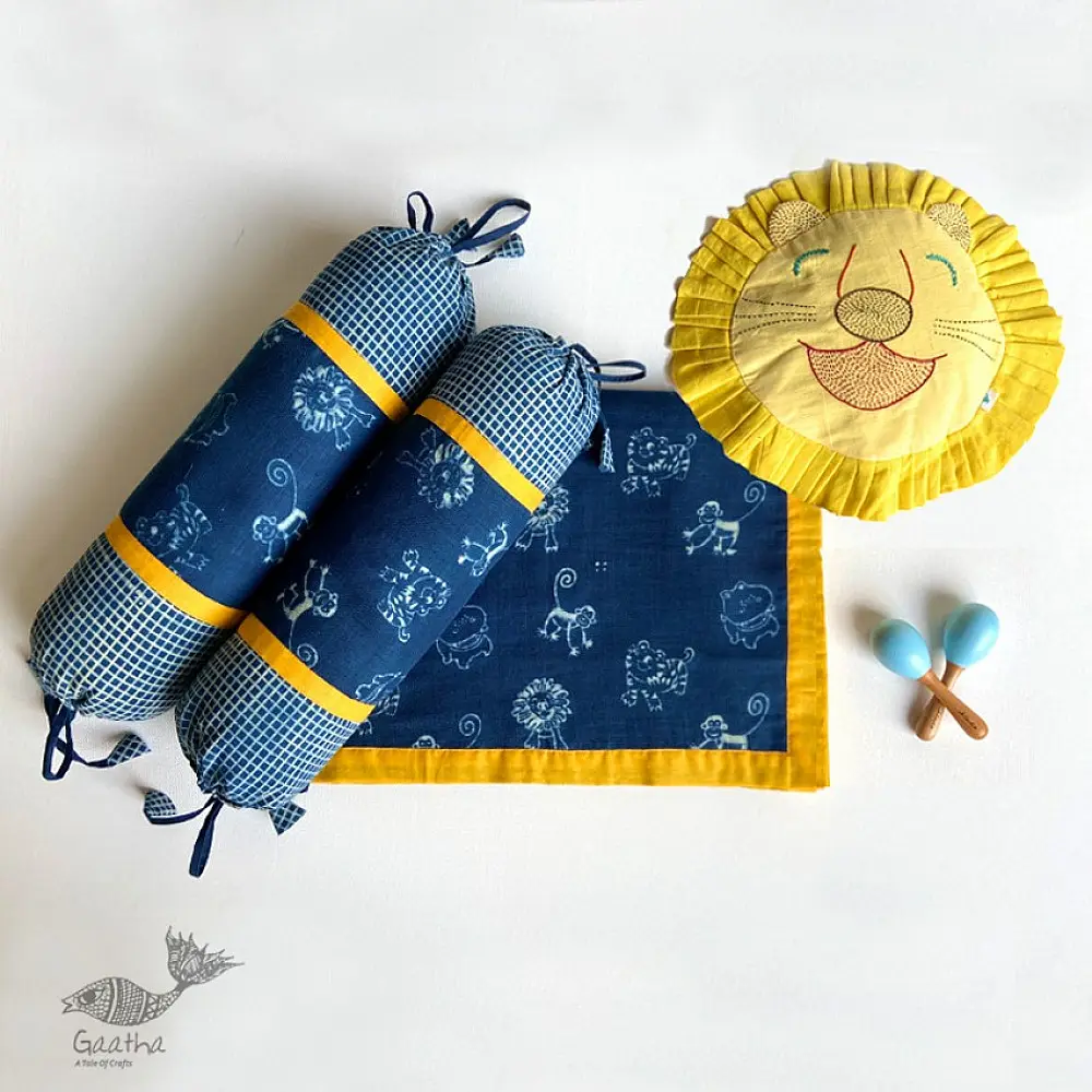 organic cotton kids luxury bedding gift set in indigo blue and yellow zoo animal prints featuring a dohar blanket mustard pillow bolsters and wooden maracas