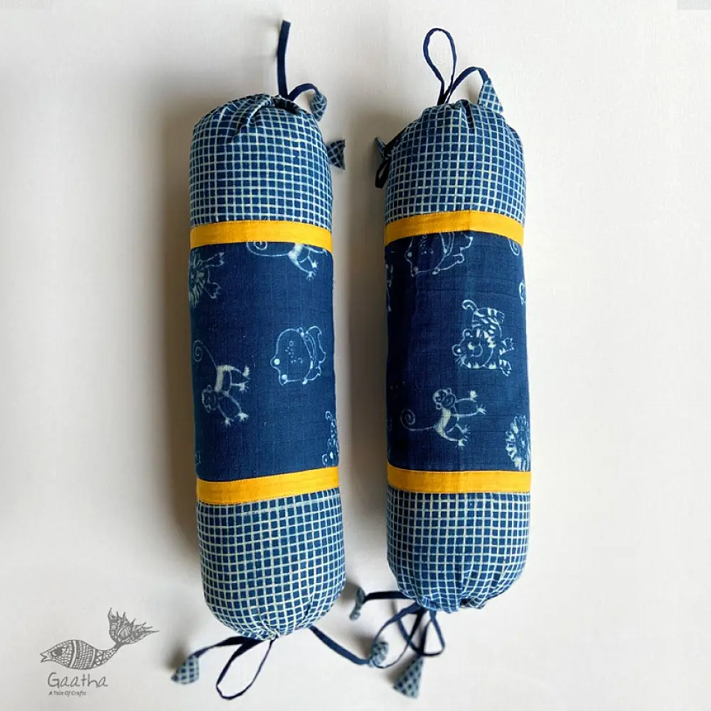 organic cotton newborn luxury bedding gift set in indigo blue zoo print featuring a soft dohar blanket round ruffle pillow matching bolsters and wooden maracas