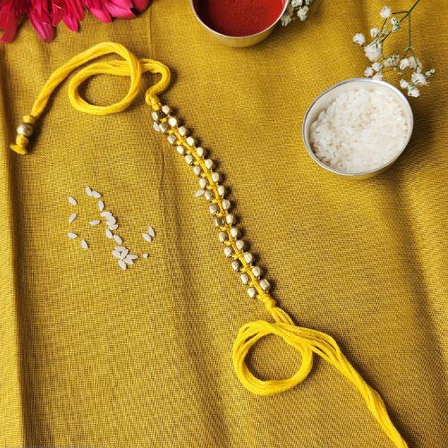 shop handmade dhokra brass rakhi Yellow Thread
