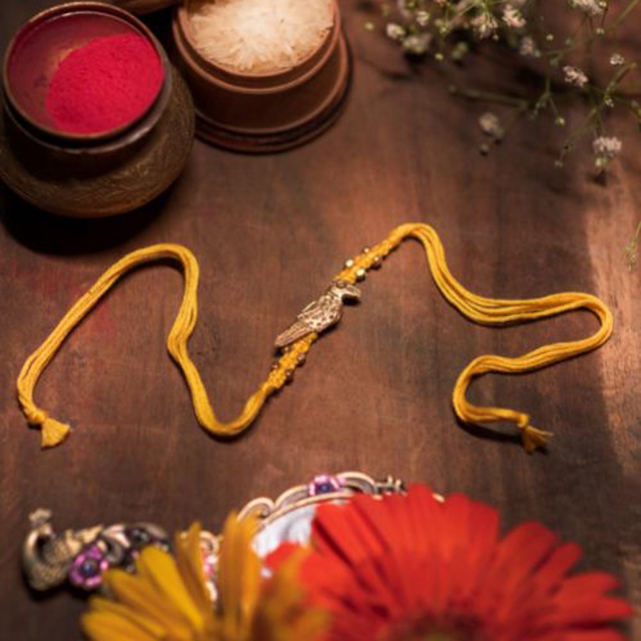 shop handmade dhokra brass rakhi - Bird