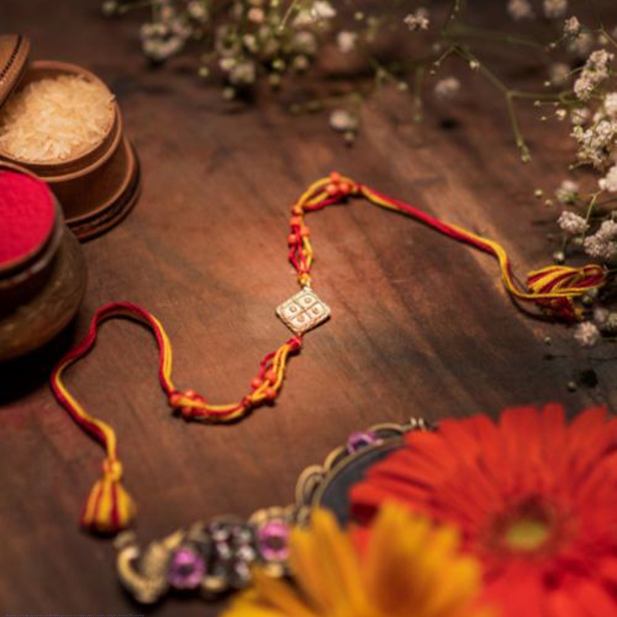 shop handmade dhokra brass rakhi  Red & Yellow Thread
