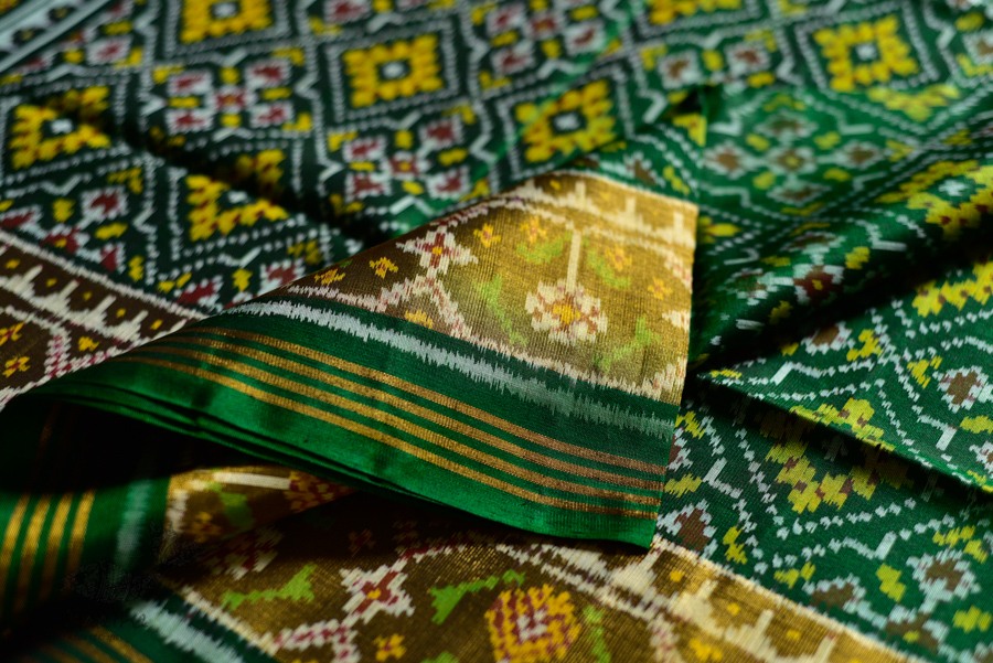 exclusive silk handwoven partola green saree